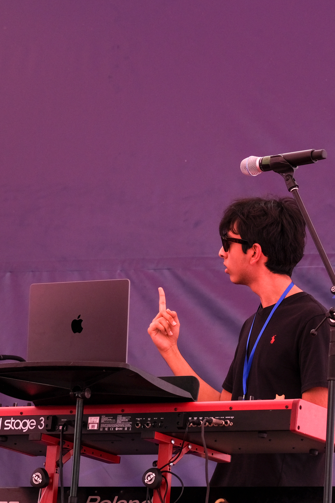 Keyboardist on stage with mic